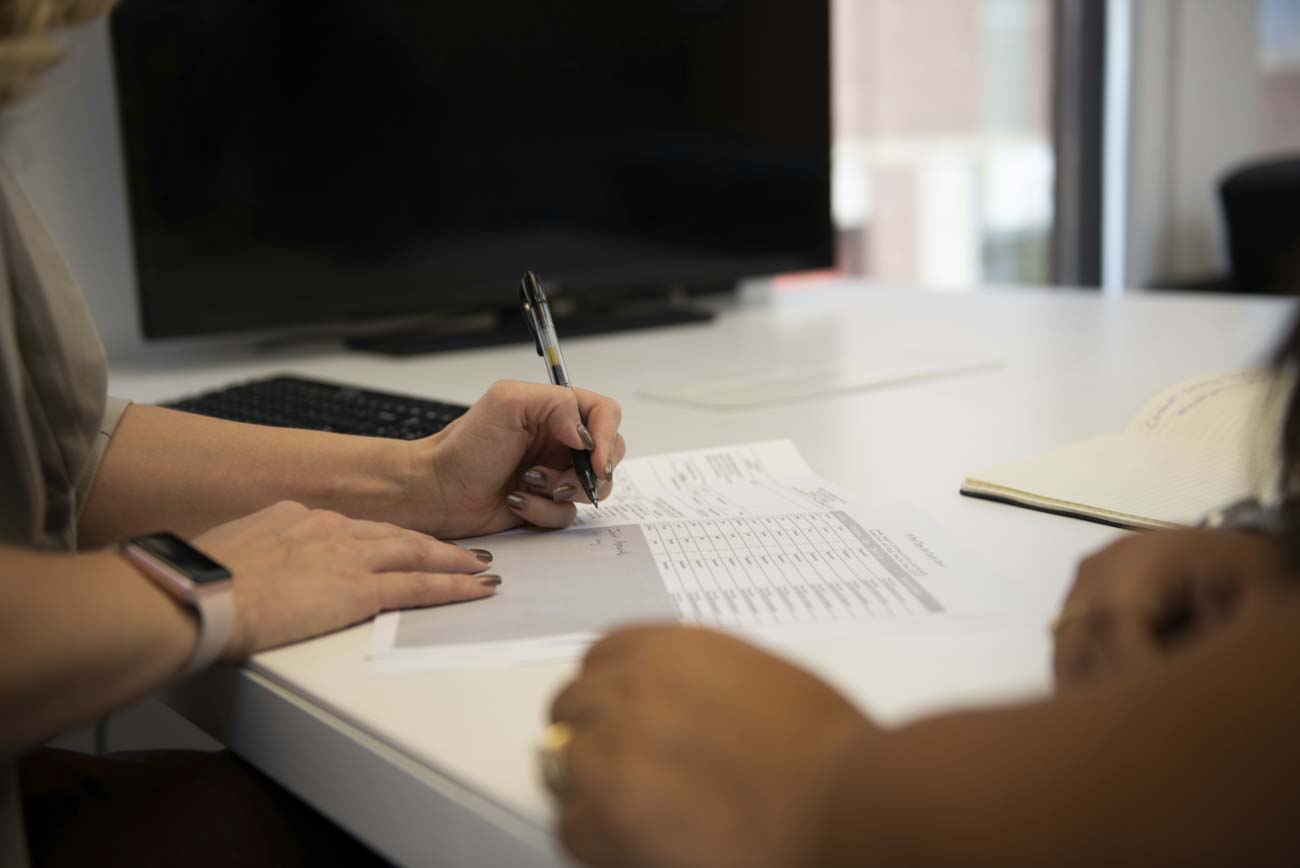 person signing forms