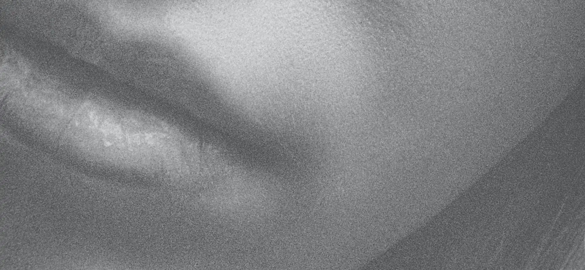 A black and white photo of a woman's face.