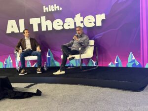 Anand and Mike talking on stage