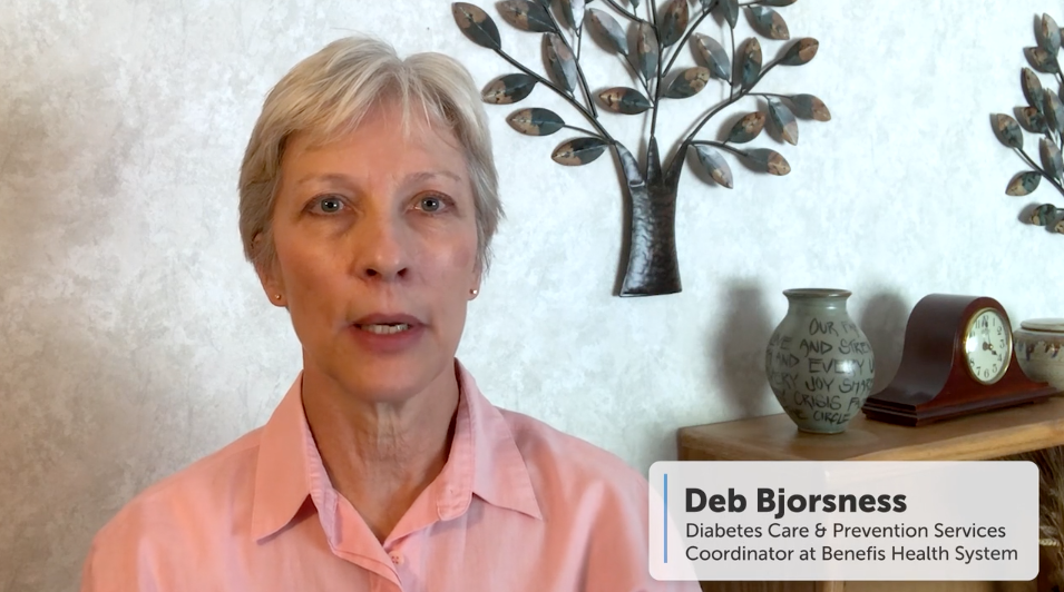 Deb Bjorsness speaks about diabetes care, with decorative wall art and a clock in the background.