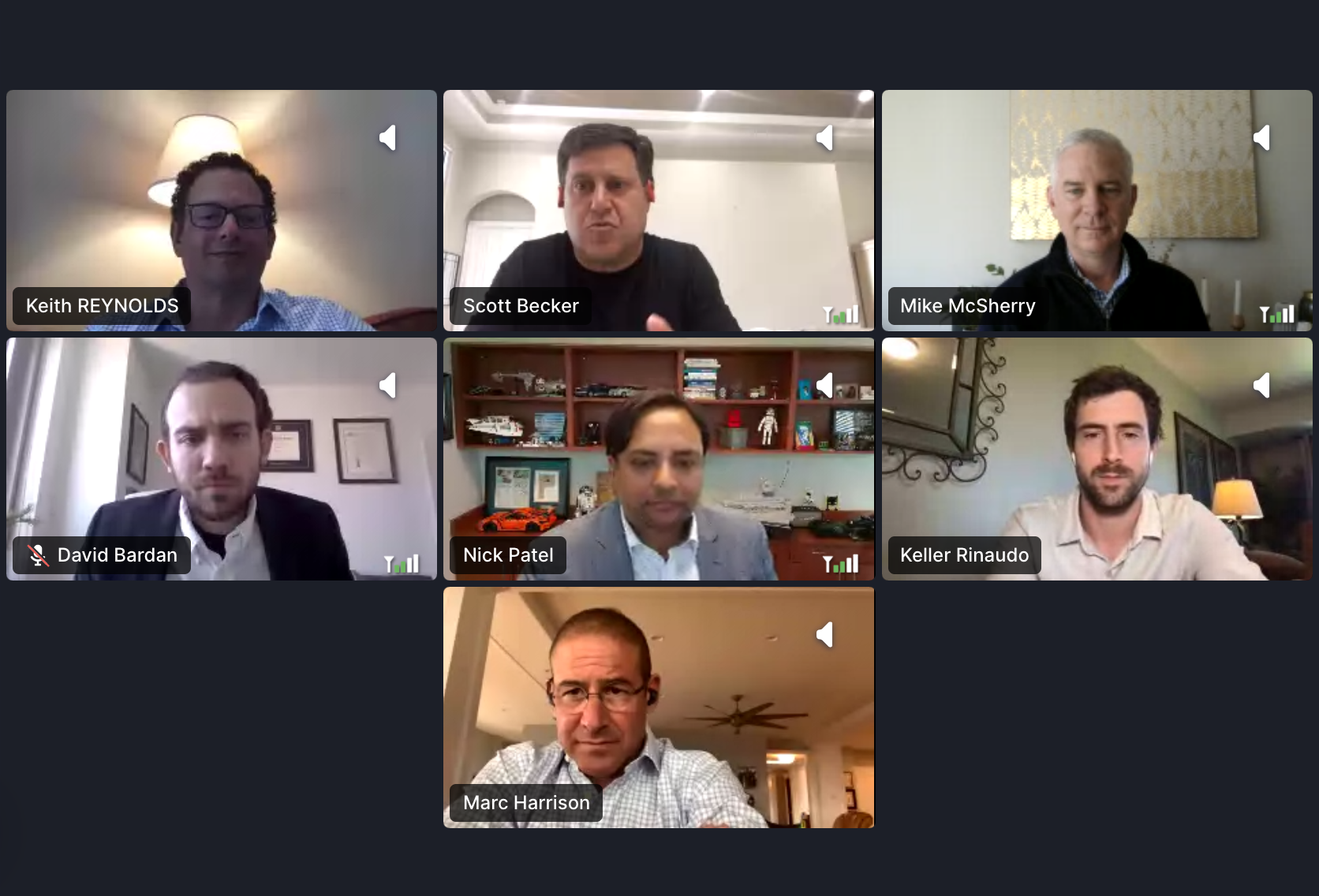 Seven professionals participating in a virtual meeting, engaged in discussion.