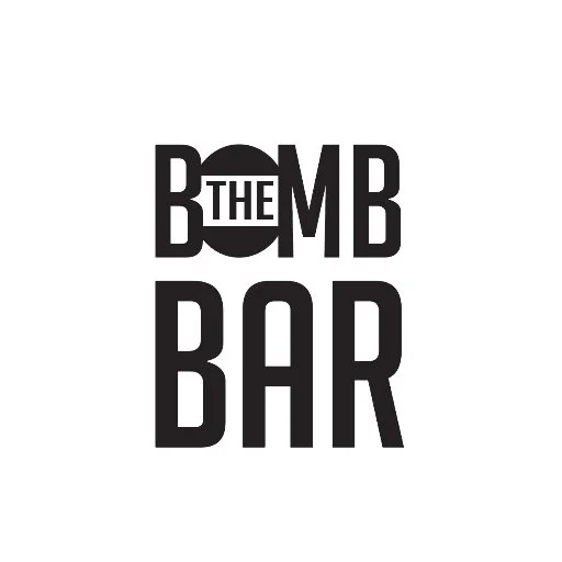 The Bomb Bar logo with the word THE inside the letter O of BOMB.