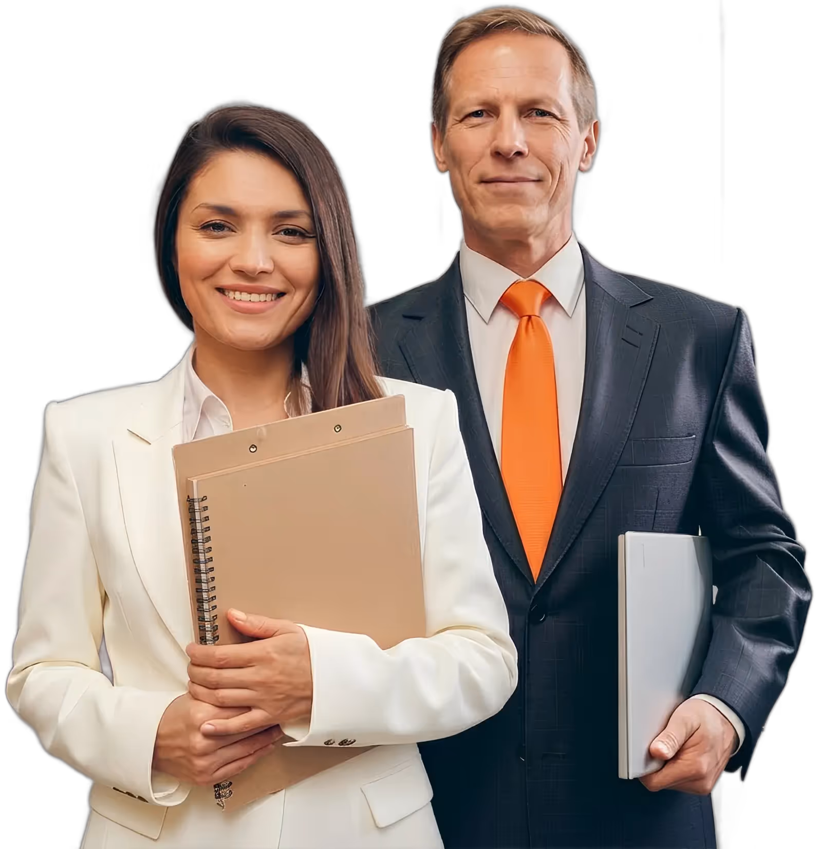 Smiling businesswoman in white suit holding notebooks and businessman in dark suit with orange tie holding a laptop.