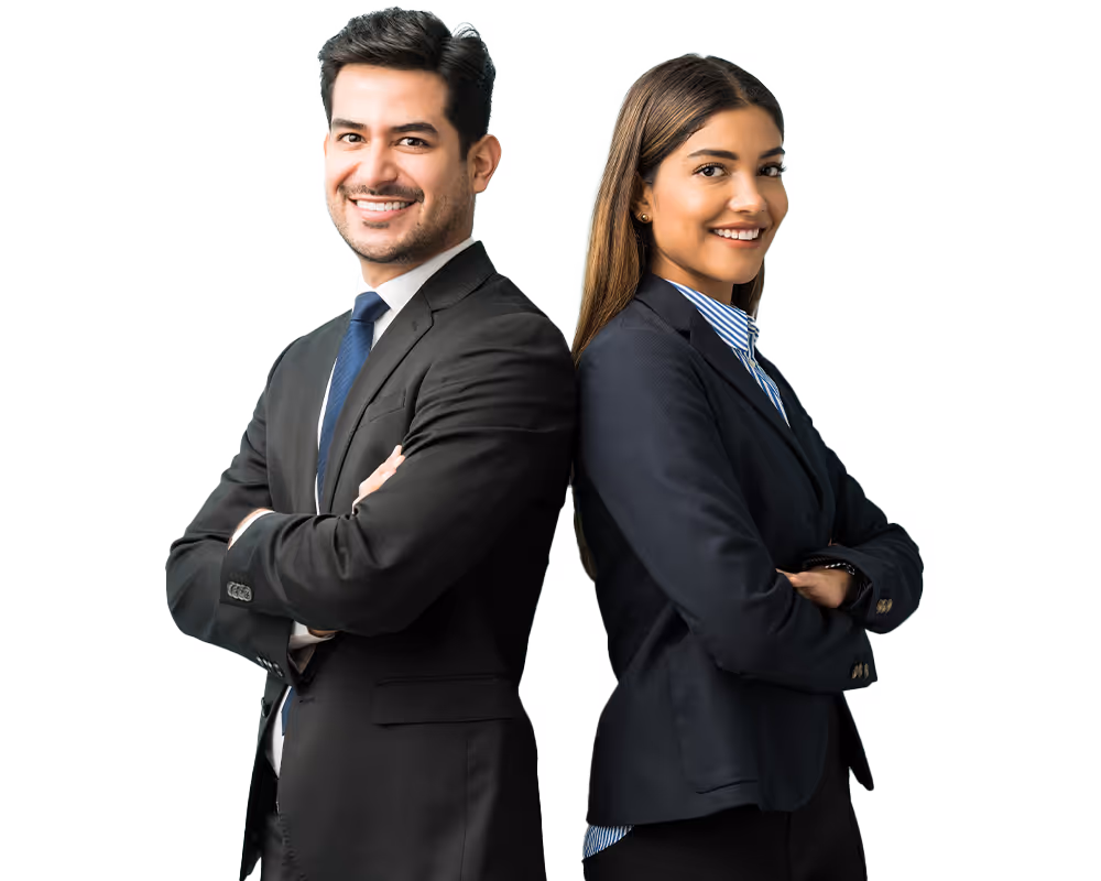 Smiling professional man and woman standing back to back with arms crossed, both wearing dark business suits.