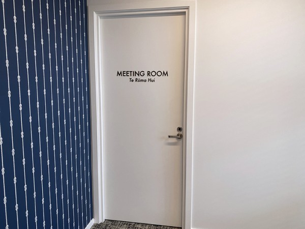 Laser-cut acrylic directional lettering