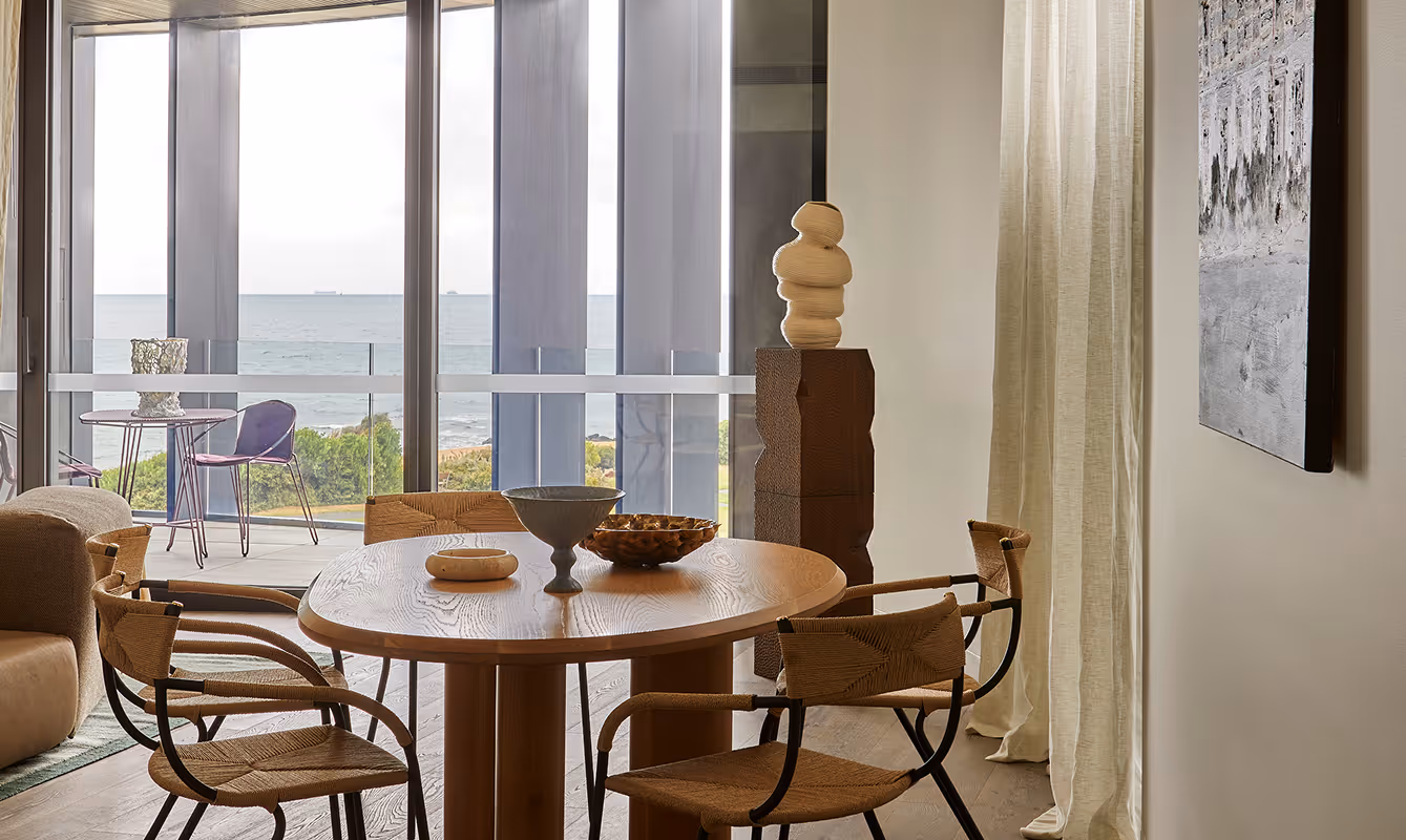 Dinner table with bowls and chairs.