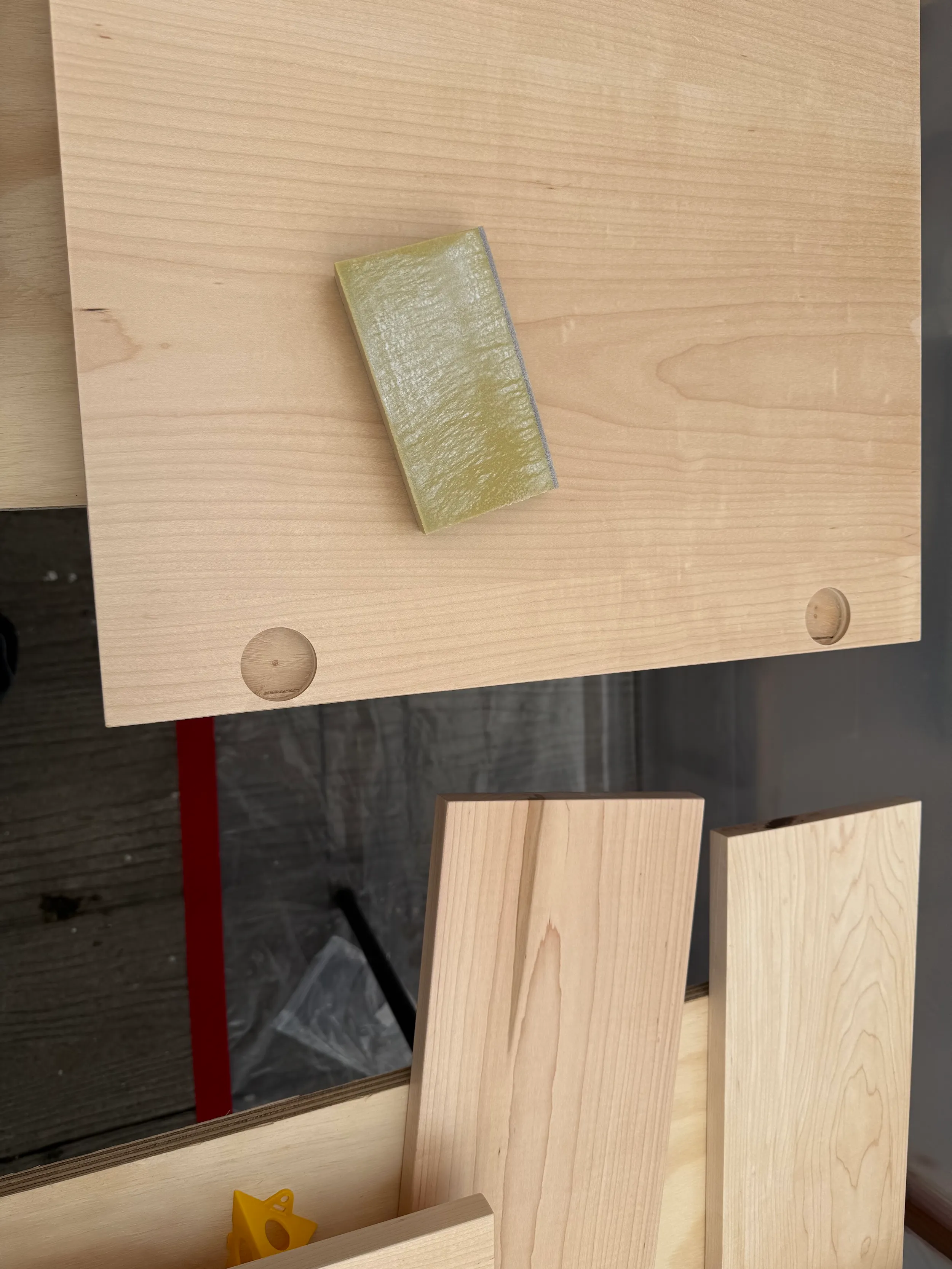 Custom maple cabinet panel fabrication with wood components, layout tools, and finish preparation.