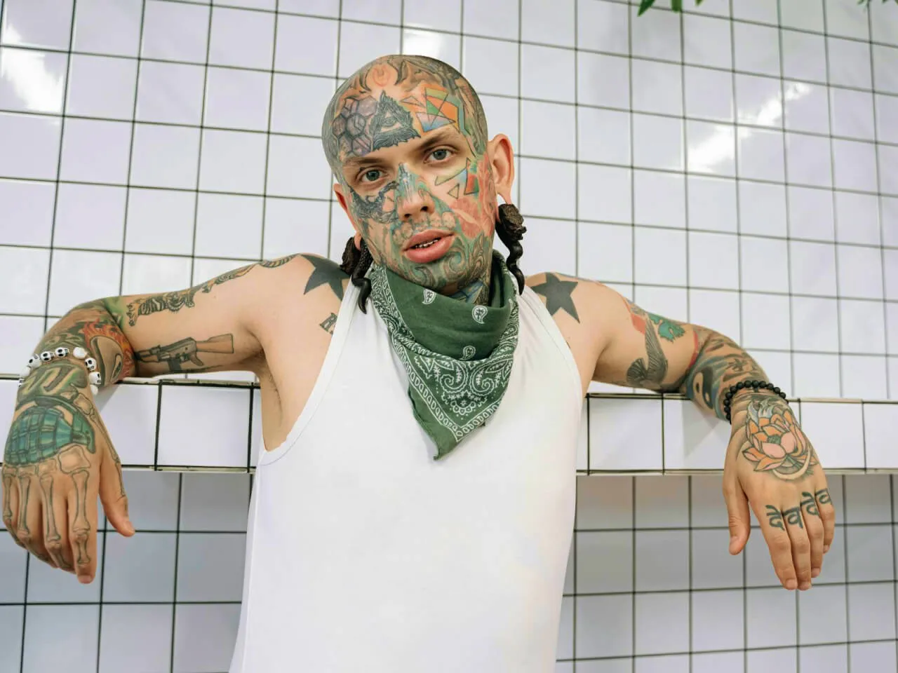 man in white tank top