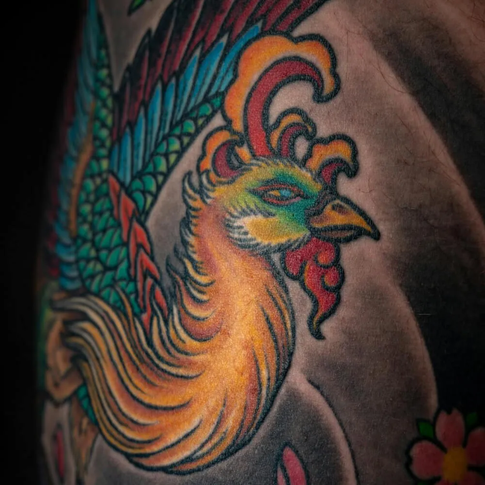 peacock arm tattoo