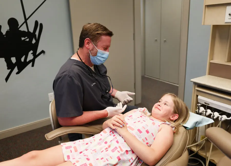Pediatric Dentist with Young Patient