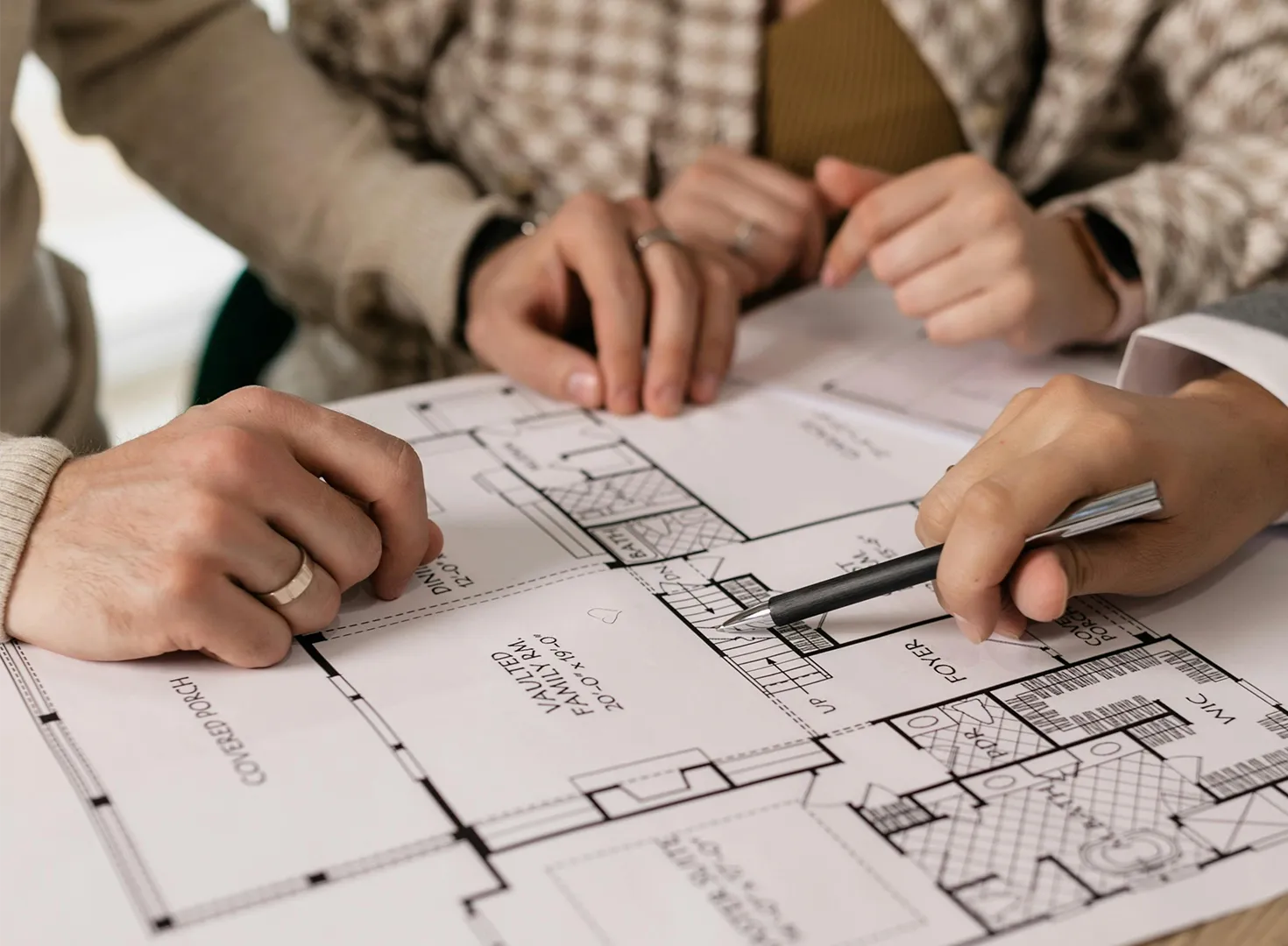 Client and builder reviewing blueprints