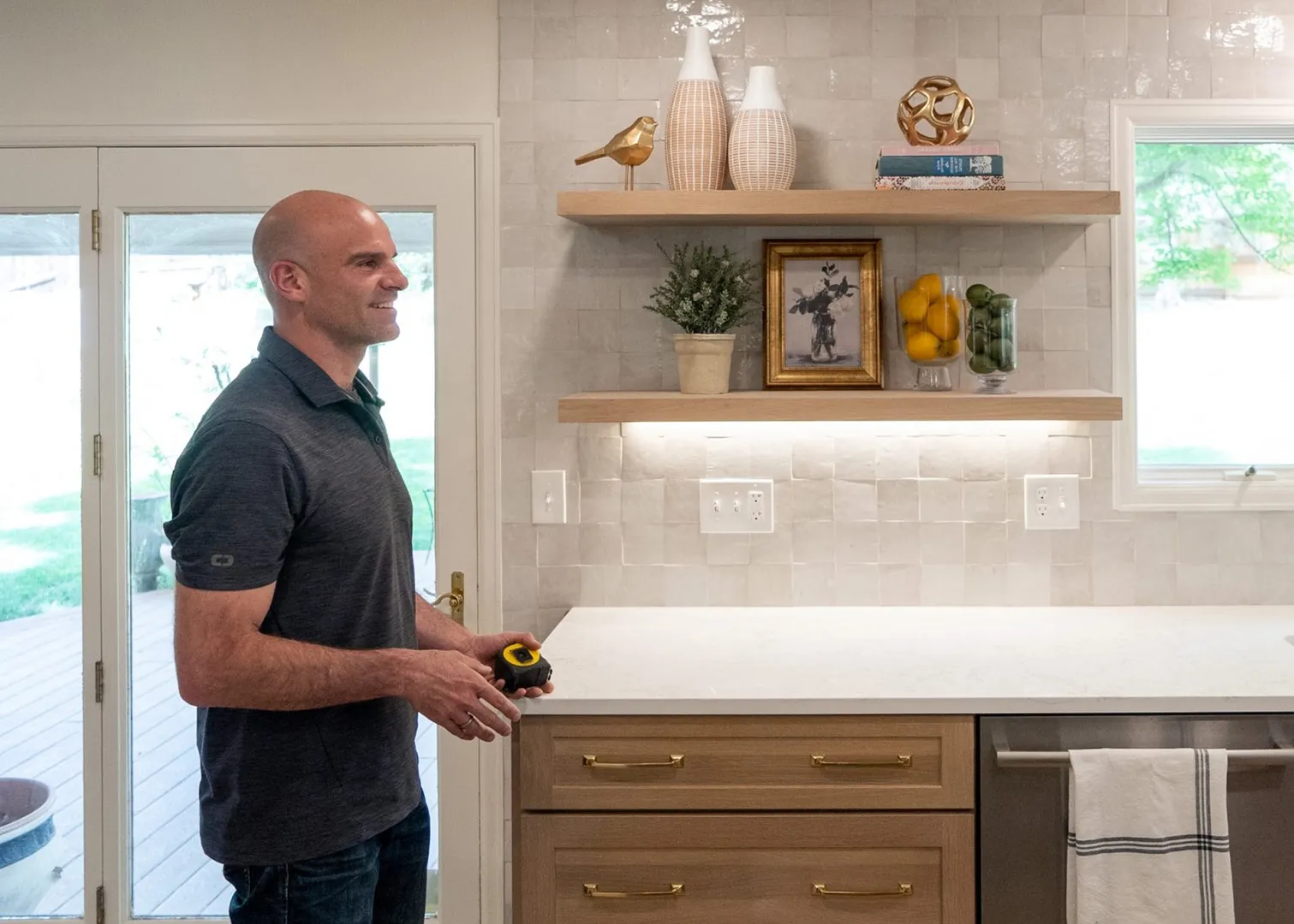 Justin Bride walking through a client's kitchen