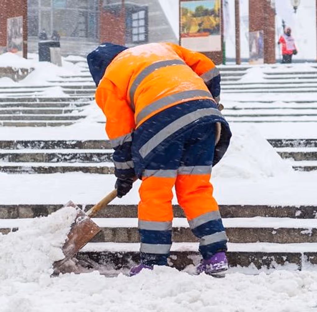 Team member hauling snow away