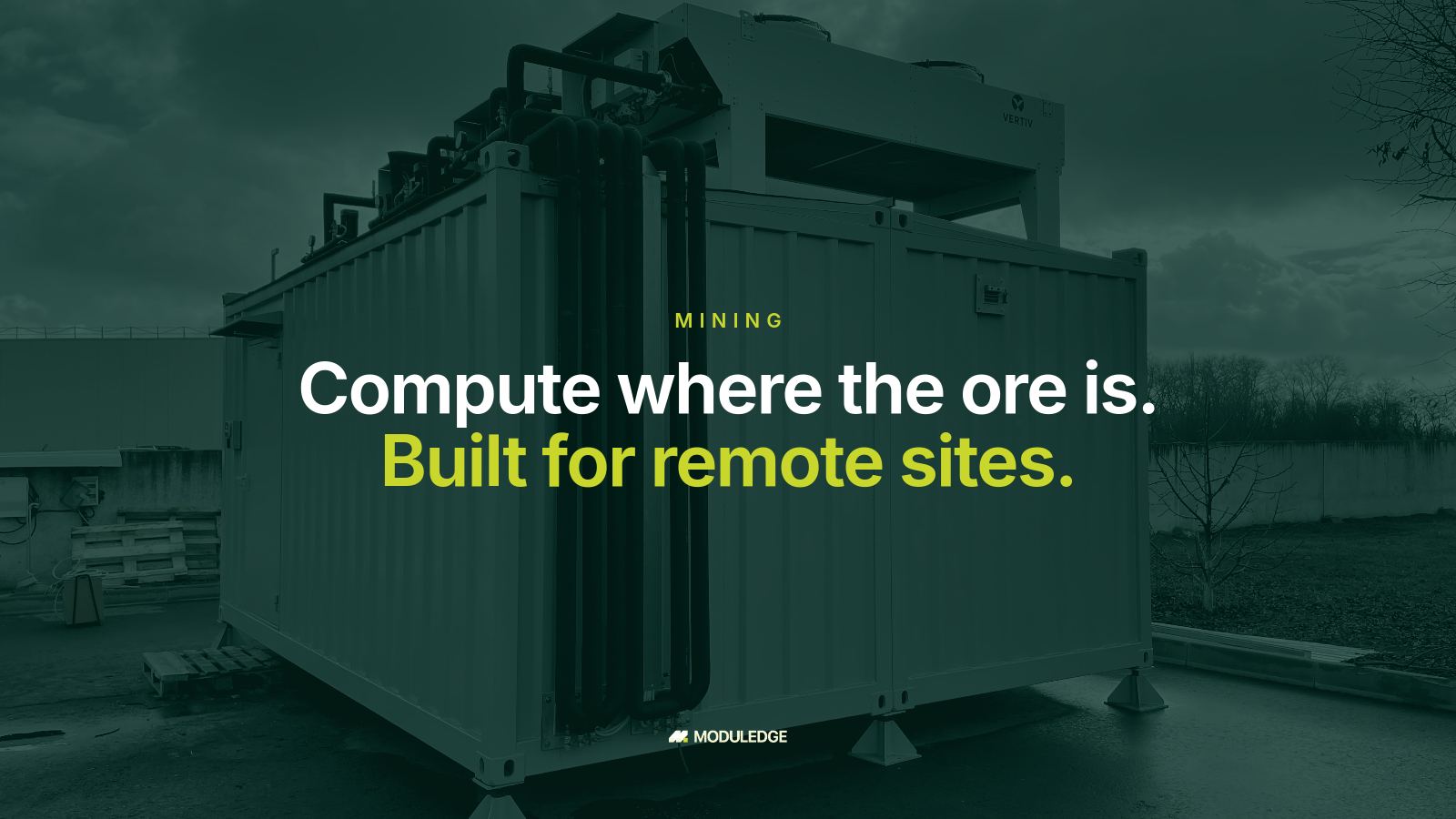 Modular data-center enclosure outdoors on an overcast day, with the headline "Compute where the ore is. Built for remote sites."