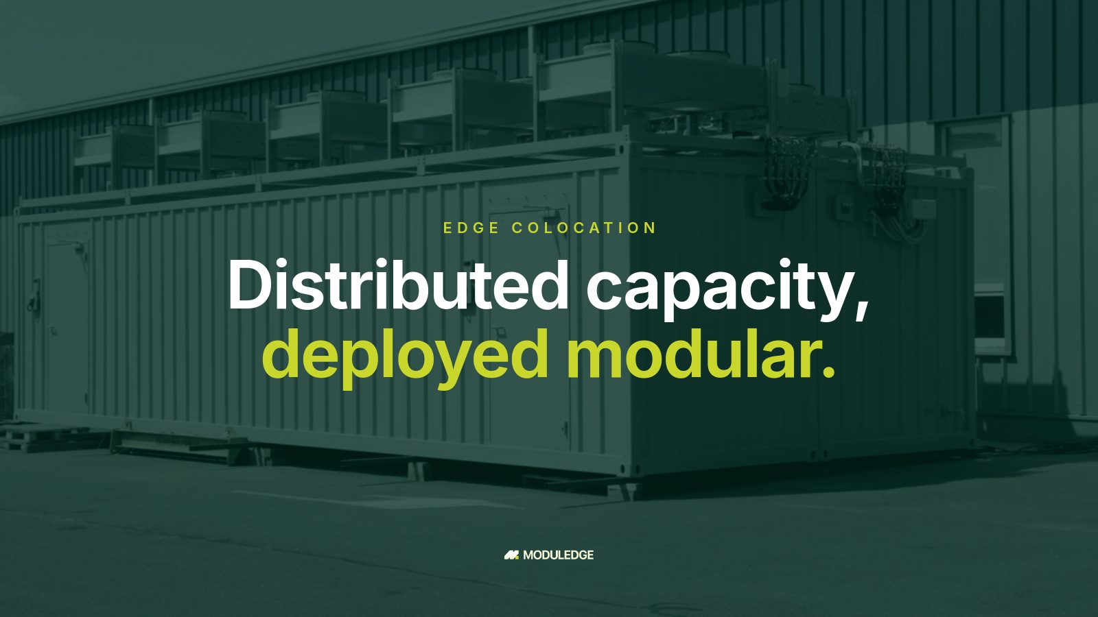 Two white modular data-center containers outside an industrial building, with the headline "Distributed capacity, deployed modular."