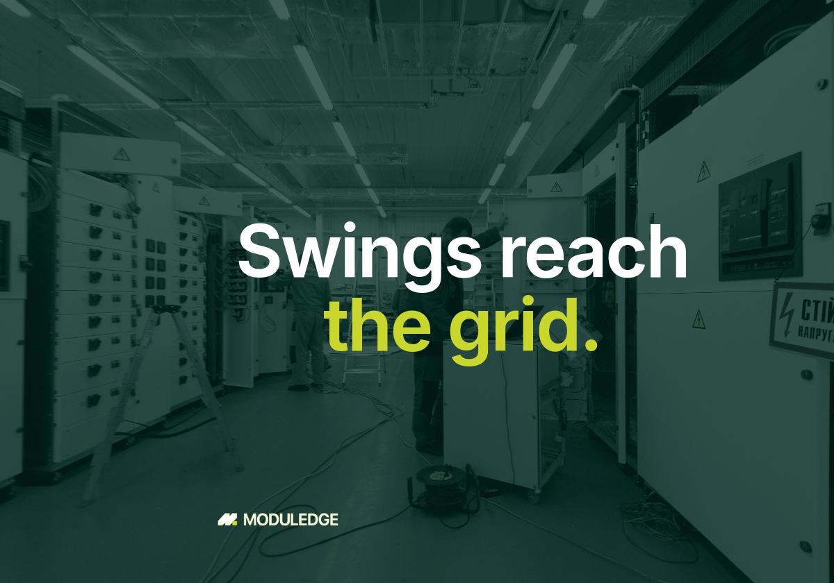 Workshop aisle lined with electrical switchgear cabinets, with the headline "Swings reach the grid."