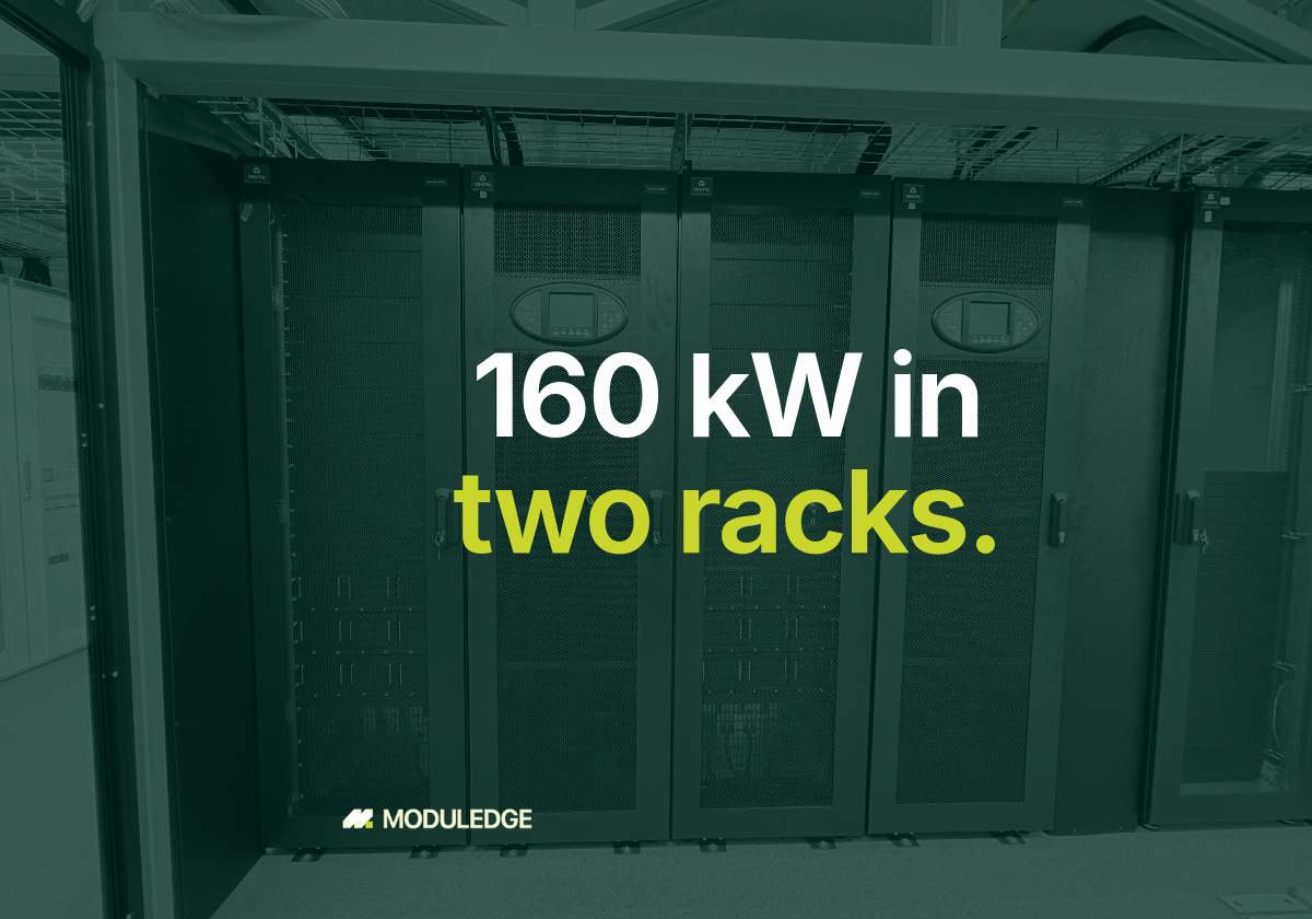 Row of server racks inside a modular data-center room, with the headline "160 kW in two racks."