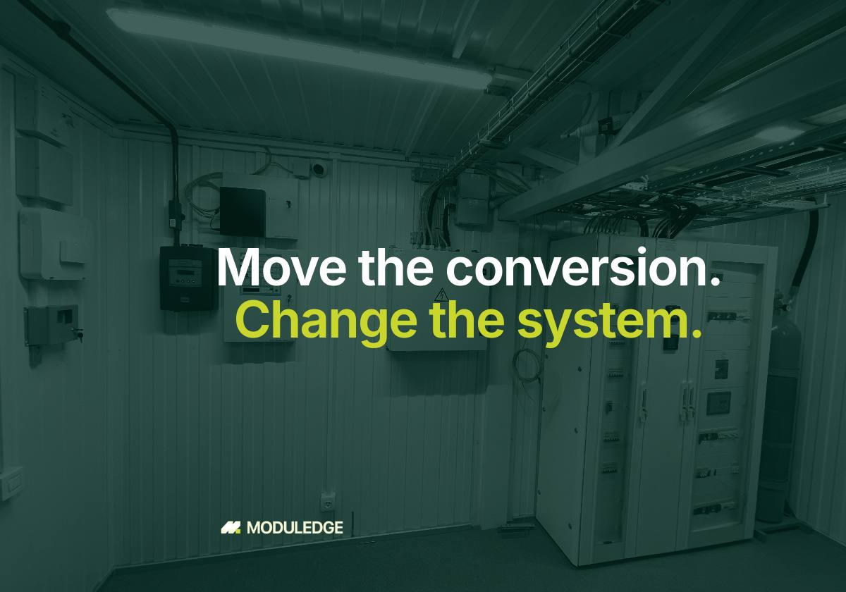 Power cabinets and cable trays inside a modular data-center room, with the headline "Move the conversion. Change the system."
