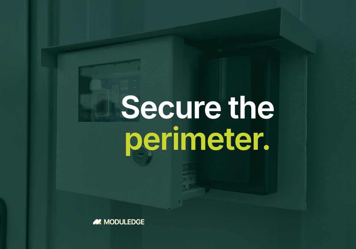 Wall-mounted control and monitoring panel inside a modular data center, with the headline "Secure the perimeter."