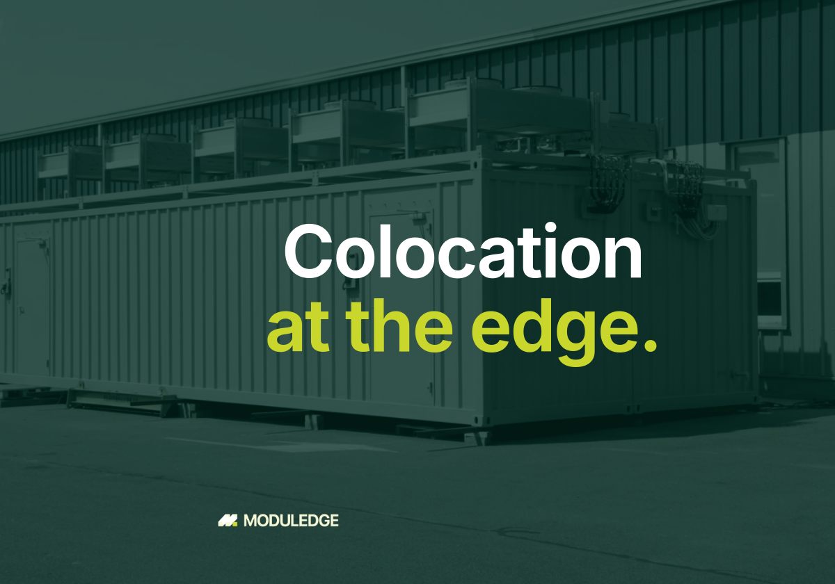 Two white modular data-center containers outside an industrial building, with the headline "Colocation at the edge."