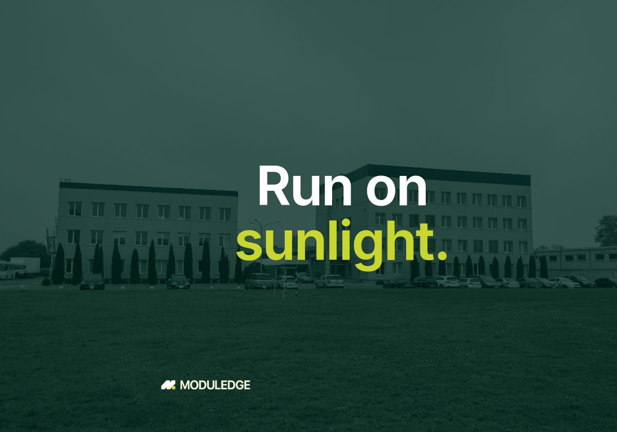 Office and industrial buildings across a green lawn, with the headline "Run on sunlight."