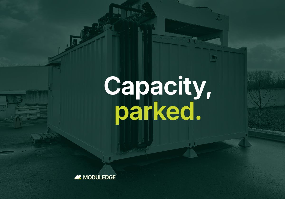 Modular data-center enclosure outdoors on an overcast day, with the headline "Capacity, parked."