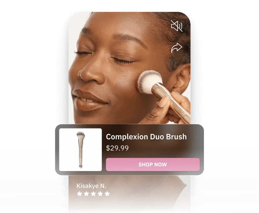 Person applying makeup with a Complexion Duo Brush, priced at $29.99, with a 'Shop Now' button and five-star rating by Kisakye N.