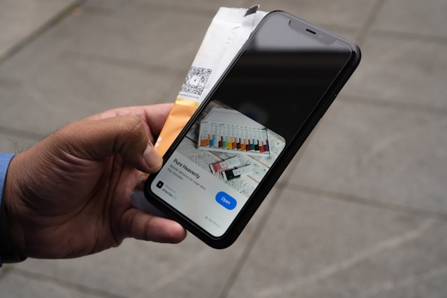 a man holding a phone buying online