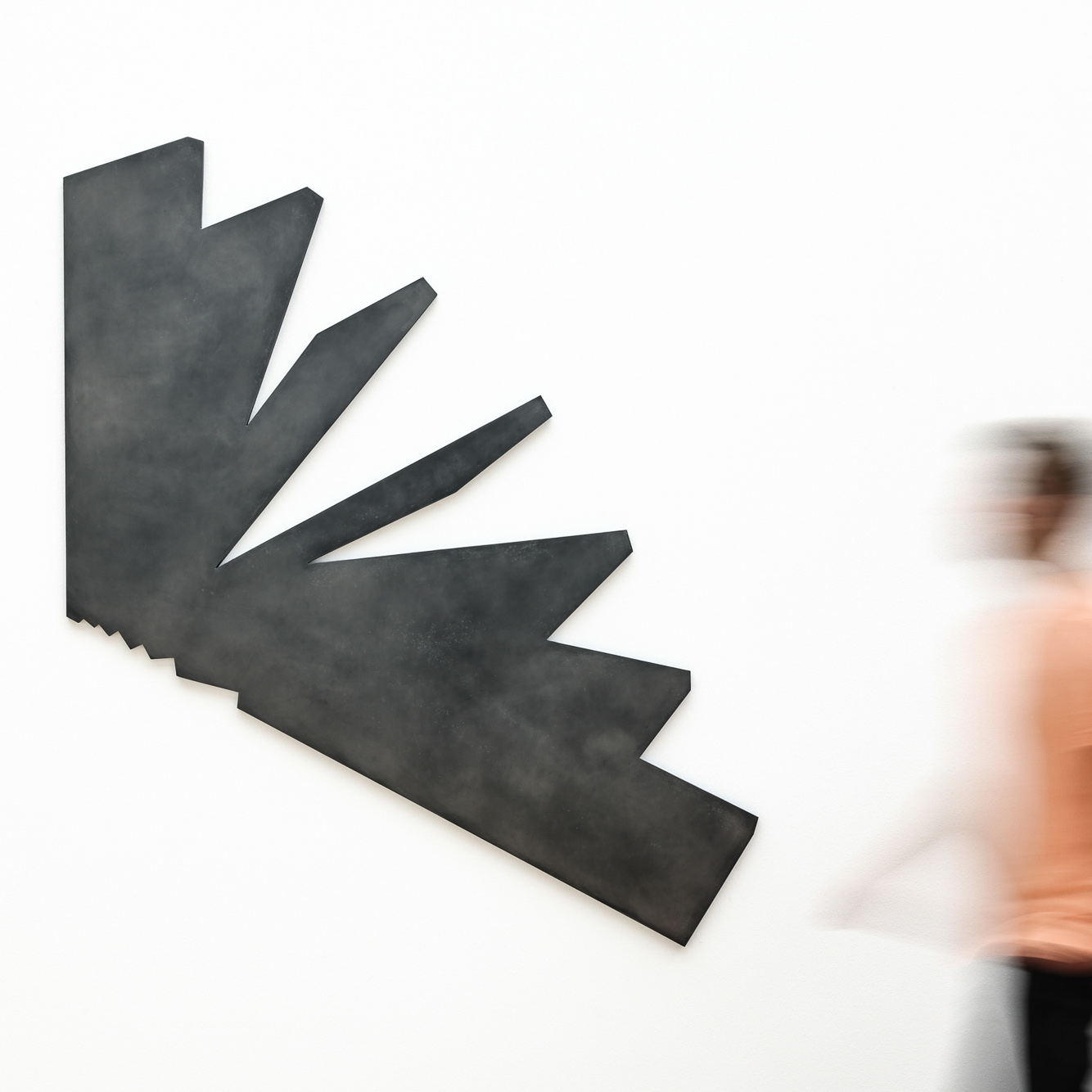 Open book showing two pages of text in German on black backgrounds with white font.