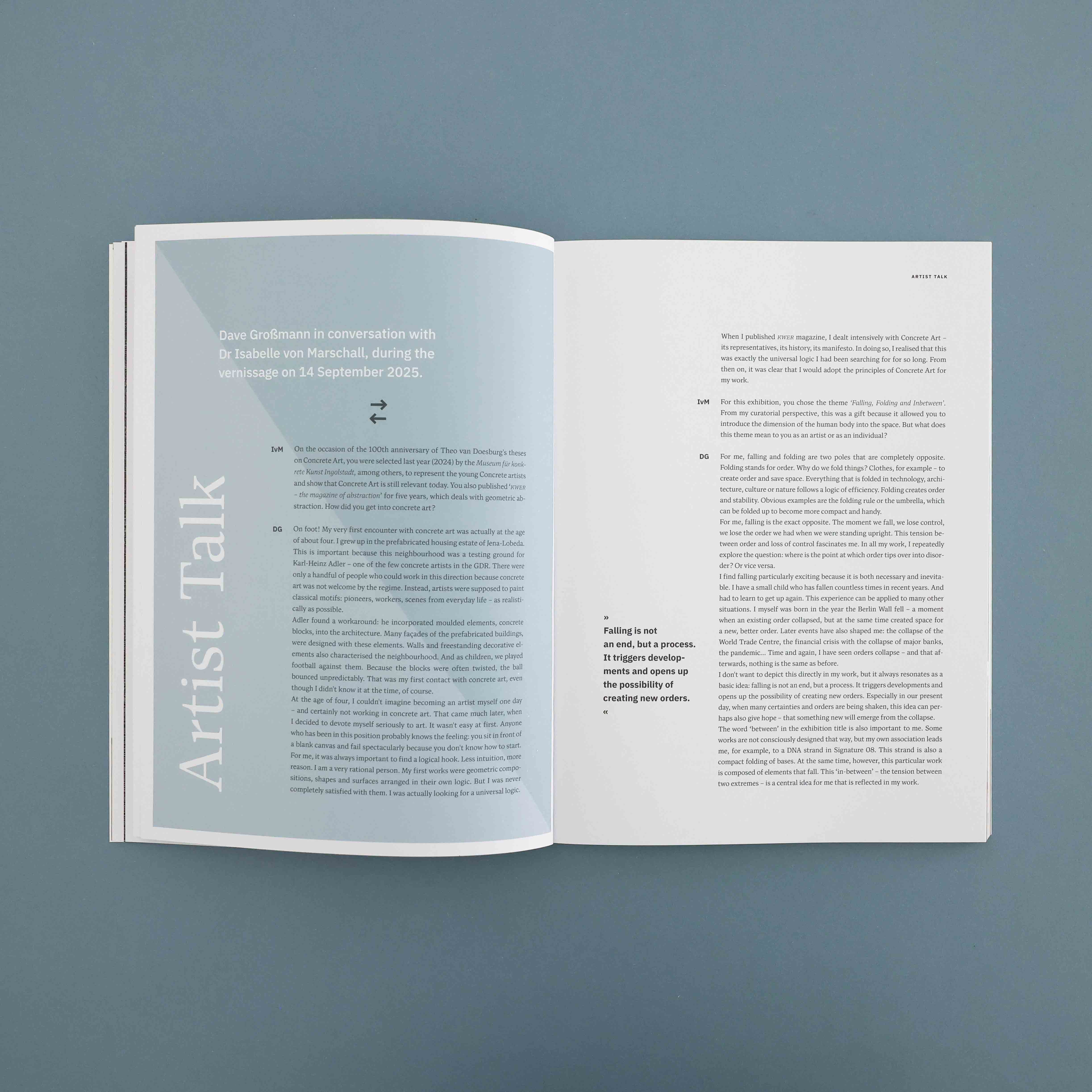 Two stacked black hardcover books with gold geometric shapes and text on the top book cover.