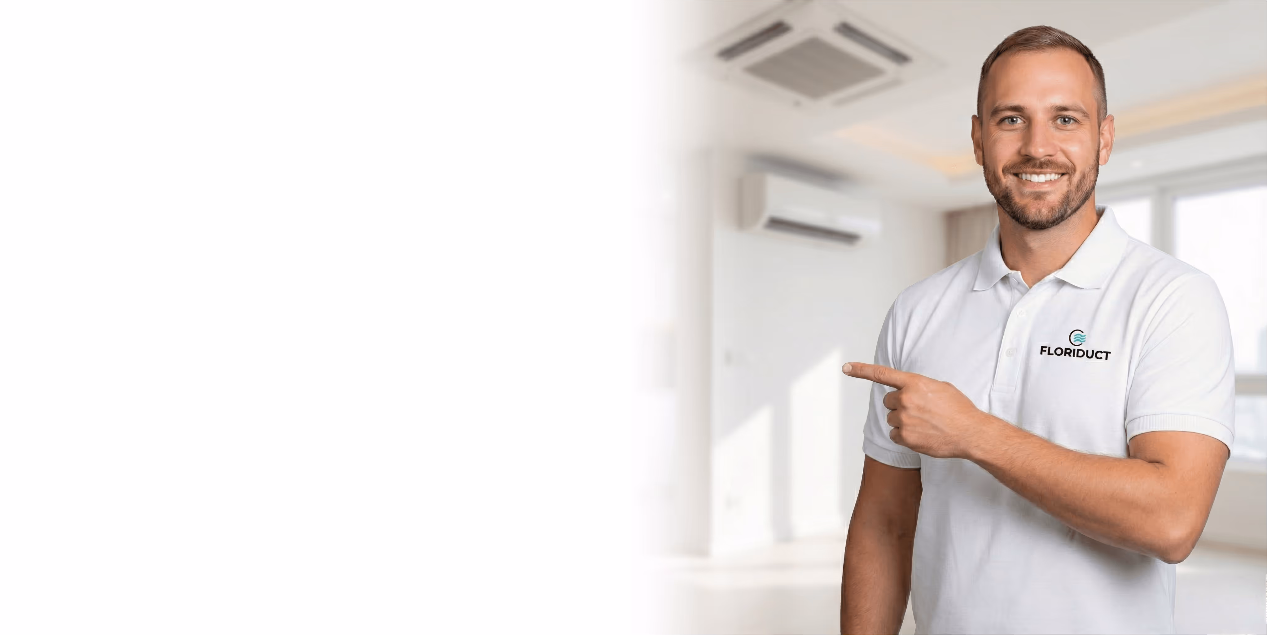 Smiling man wearing a white Floriduct polo shirt pointing to the left in a bright room with air conditioning units.