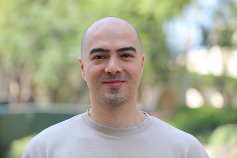 [headshot] image of satisfied student using a laptop