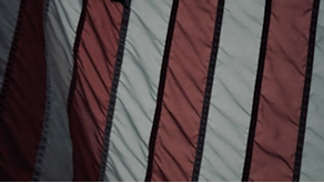 Better Flags | CiClO Flags | Close-up of red and white striped fabric with black seams.