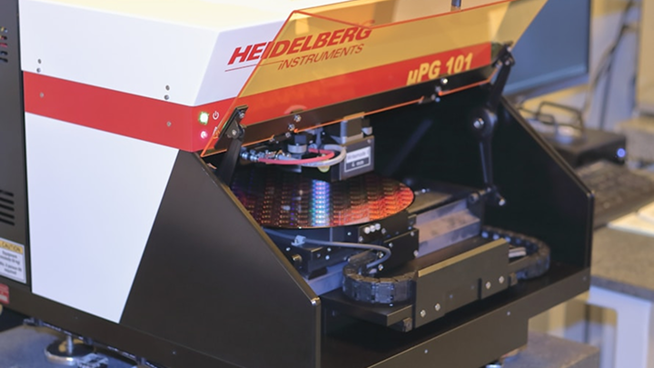 Better Flags | CiClO Flags | Heidelberg Instruments µPG 101 photolithography device with a wafer inside on a lab bench.