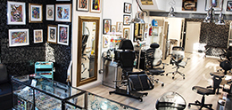 Demand exploded. Extra chairs were added one by one, and a professional piercing room joined the floorplan—giving clients a full spectrum of body art under one roof.
