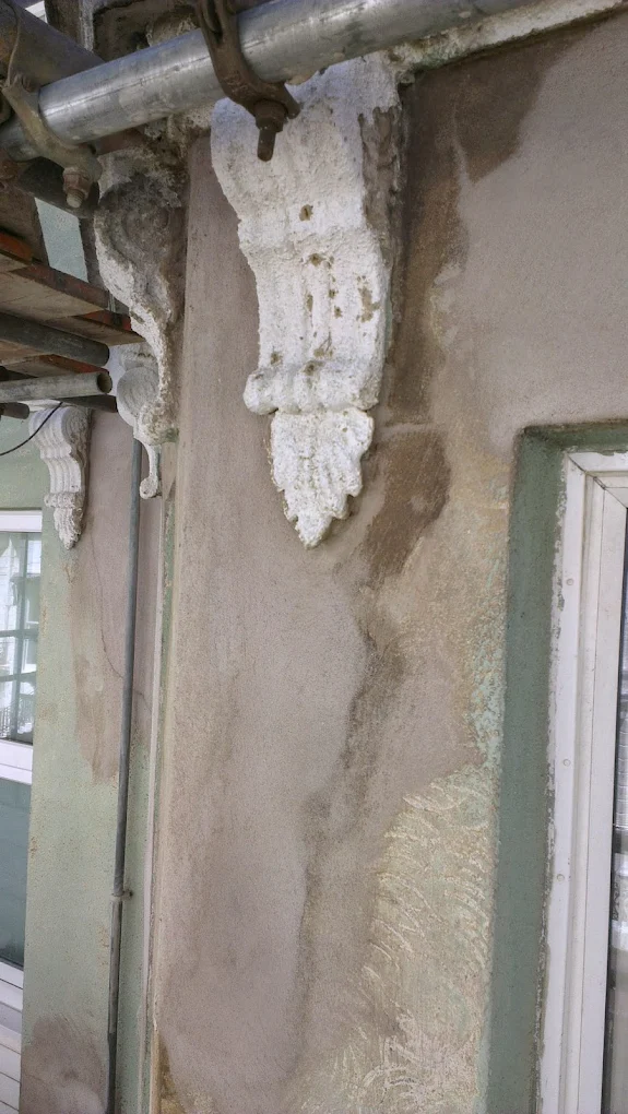 The recently repaired decorative masonry on the facade of a hotel in Eastbourne, East Sussex