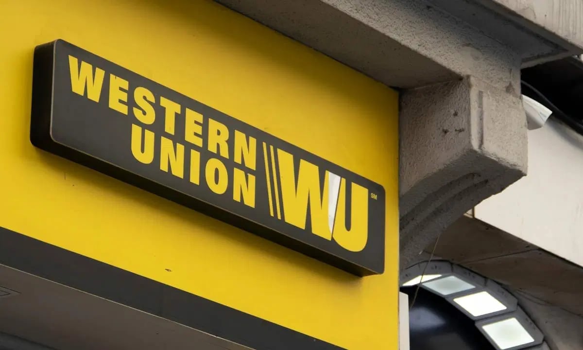Western Union yellow and black sign mounted on building exterior.
