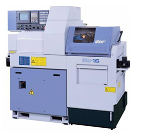 Industrial CNC lathe machine with control panel and blue-gray body.