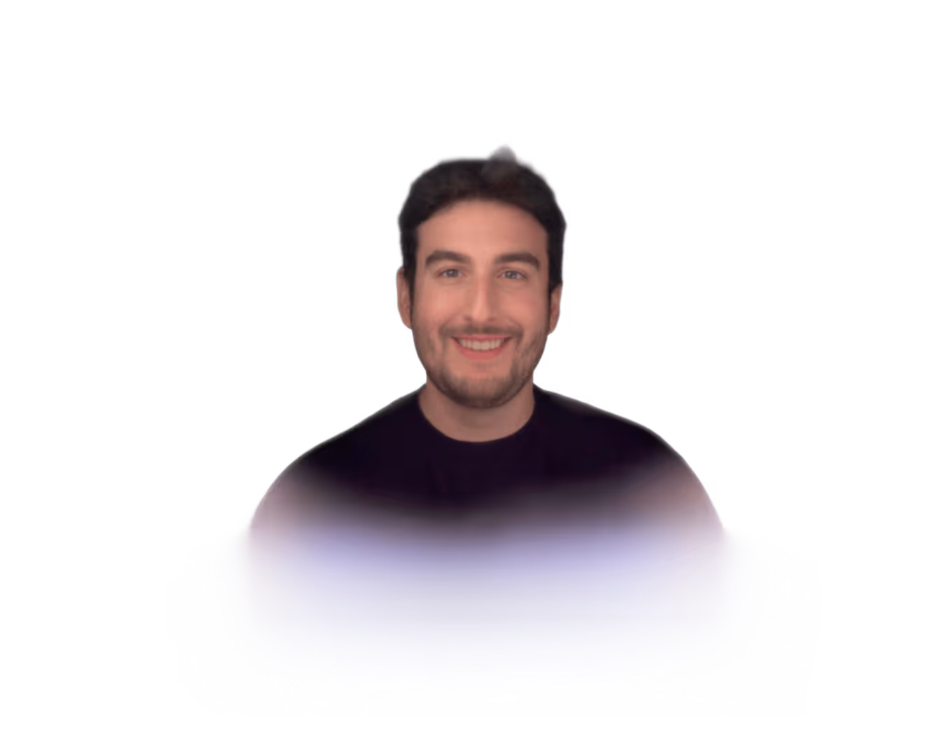 Tom persona. Smiling man with dark hair and beard wearing a dark shirt on a white gradient background.