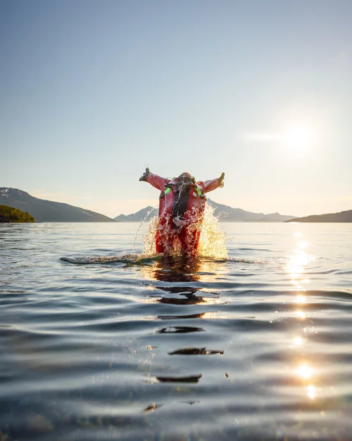 Jumping in Arctic water - Floating in Arctic Water - Authentic North