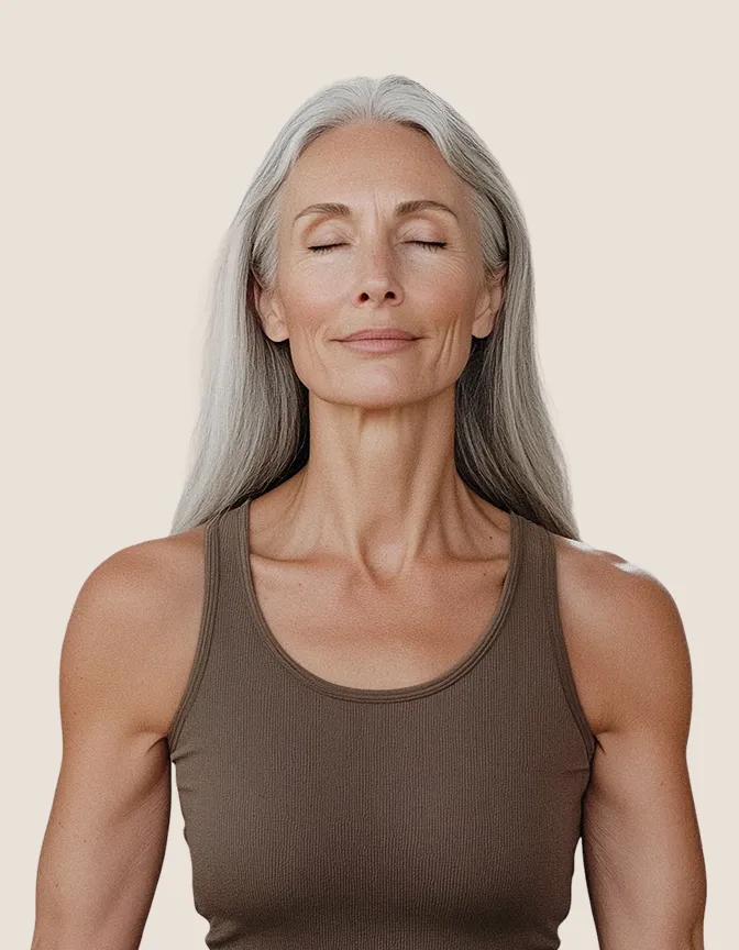 Smiling yoga instructor in beige top