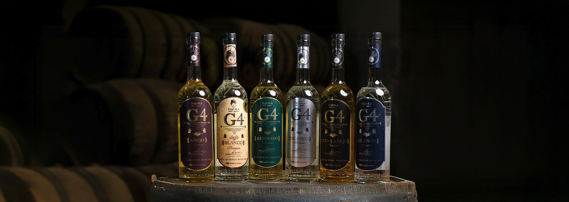 The G4 Tequila range lined up on a barrel at El Pandillo: Blanco, Reposado, Añejo and Extra Añejo