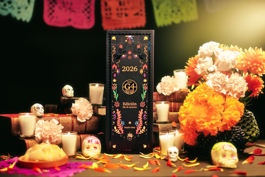 G4 Día de Muertos box on an ofrenda with marigolds and papel picado