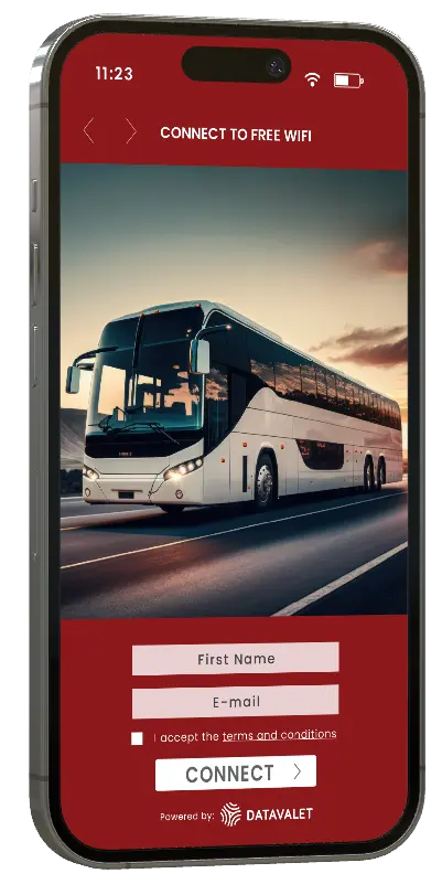 Smartphone screen showing a captive portal to connect to free WiFi with a background image of a white coach bus on a road at sunset, including fields to enter first name and email, a terms and conditions checkbox, and a connect button.