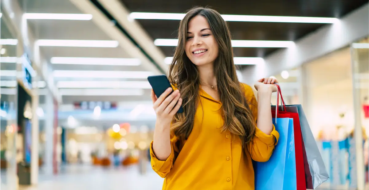 Shopper in Retail on her Phone in a mall - Datavalet