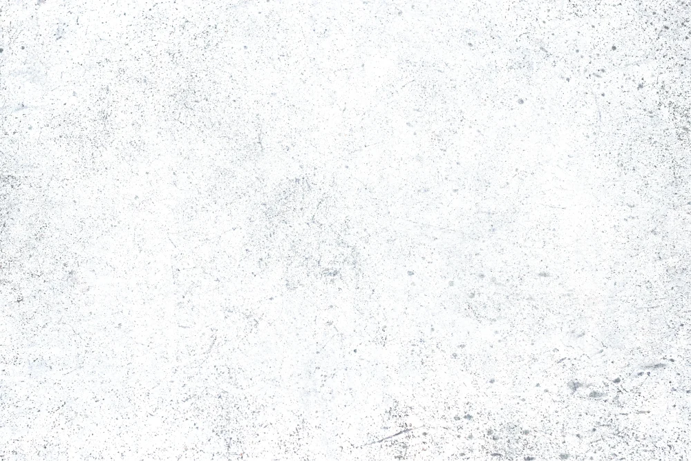 White textured surface with scattered black specks and subtle scratches.