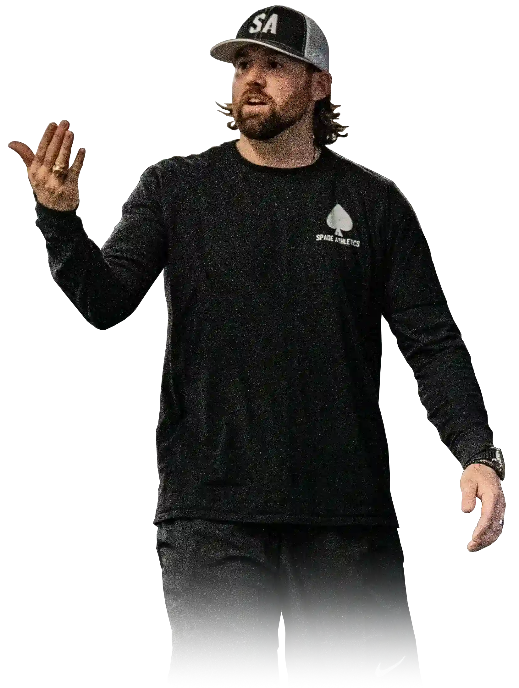 Man wearing a black long-sleeve shirt with Spade Athletics logo and a black and white cap gesturing with one hand.