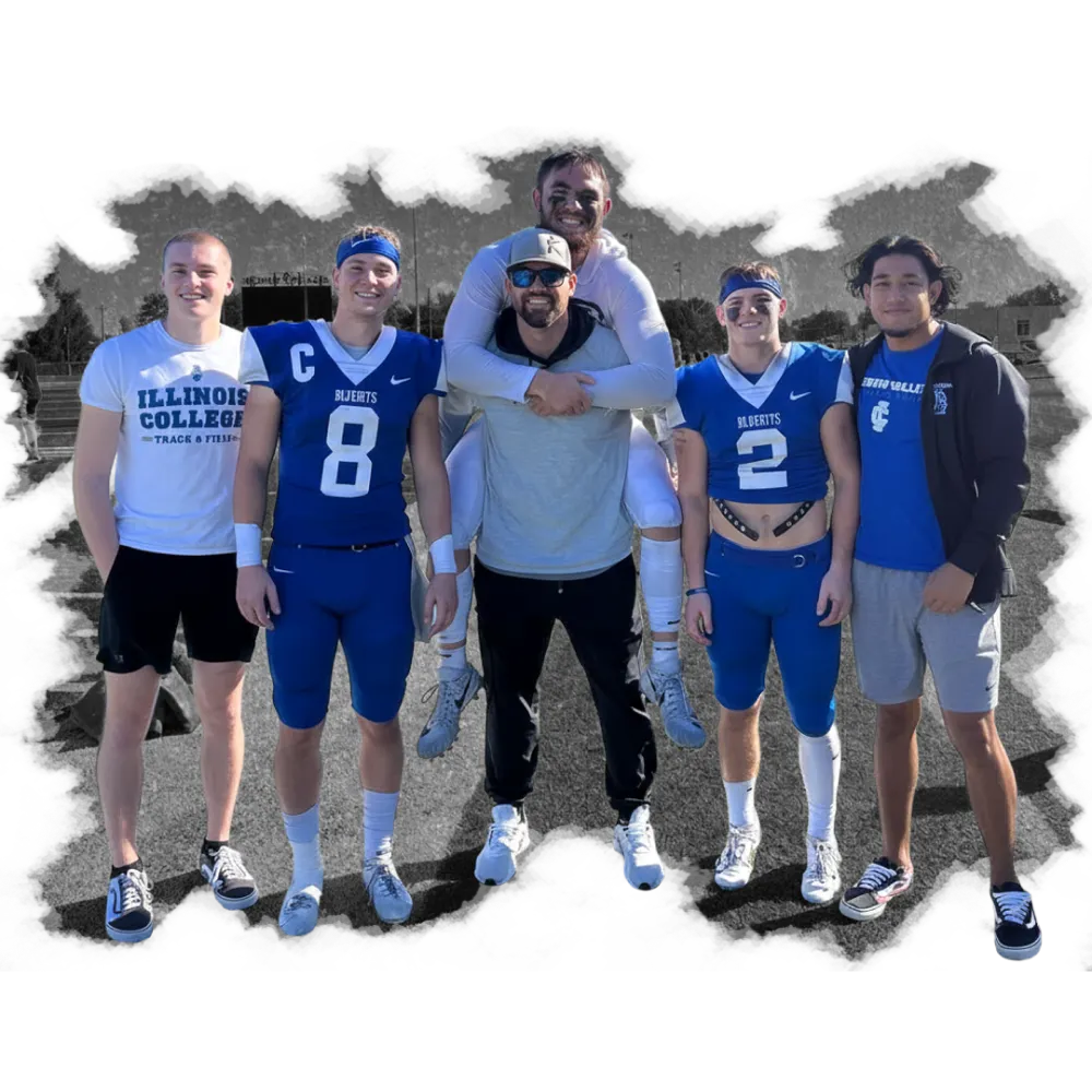 Group of young athletes posing together after a training session at Spade Athletics.