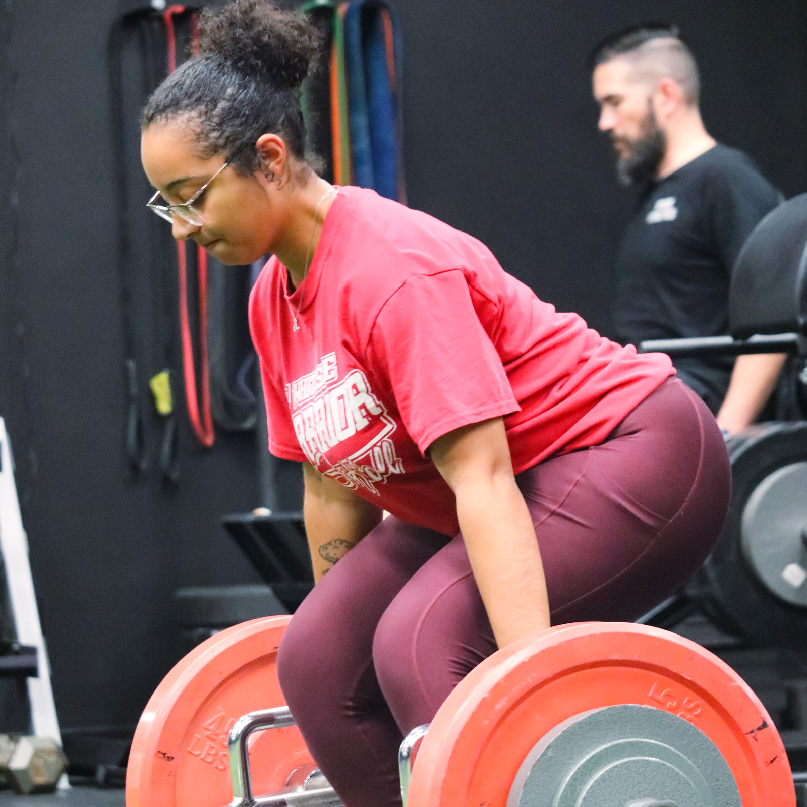 woman lifting heavy weights