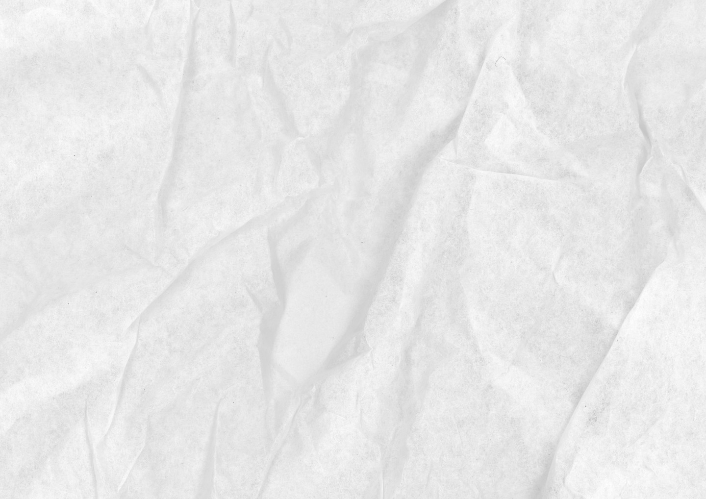 Close-up of white crumpled paper texture with visible creases and wrinkles.